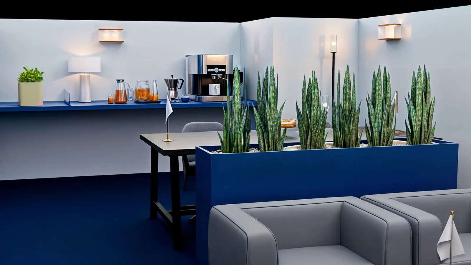 Booth lounge with grey sofas and planters
